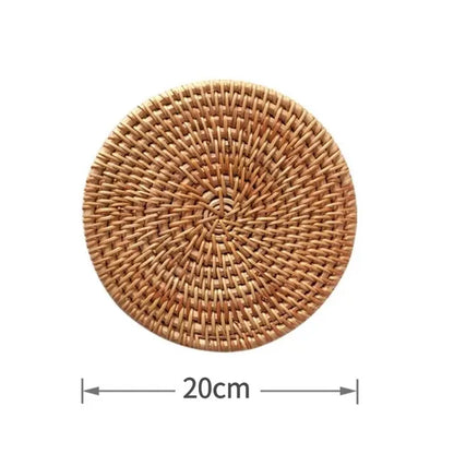 Round natural rattan cup mat hot pad, hand-woven hot insulation placemats for table padding in kitchen decoration.