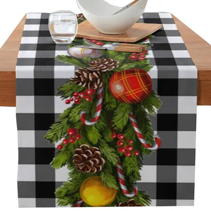 Christmas-themed printed table runner with poinsettia flower, faceless gnome, elk, tree, and snowflake design.